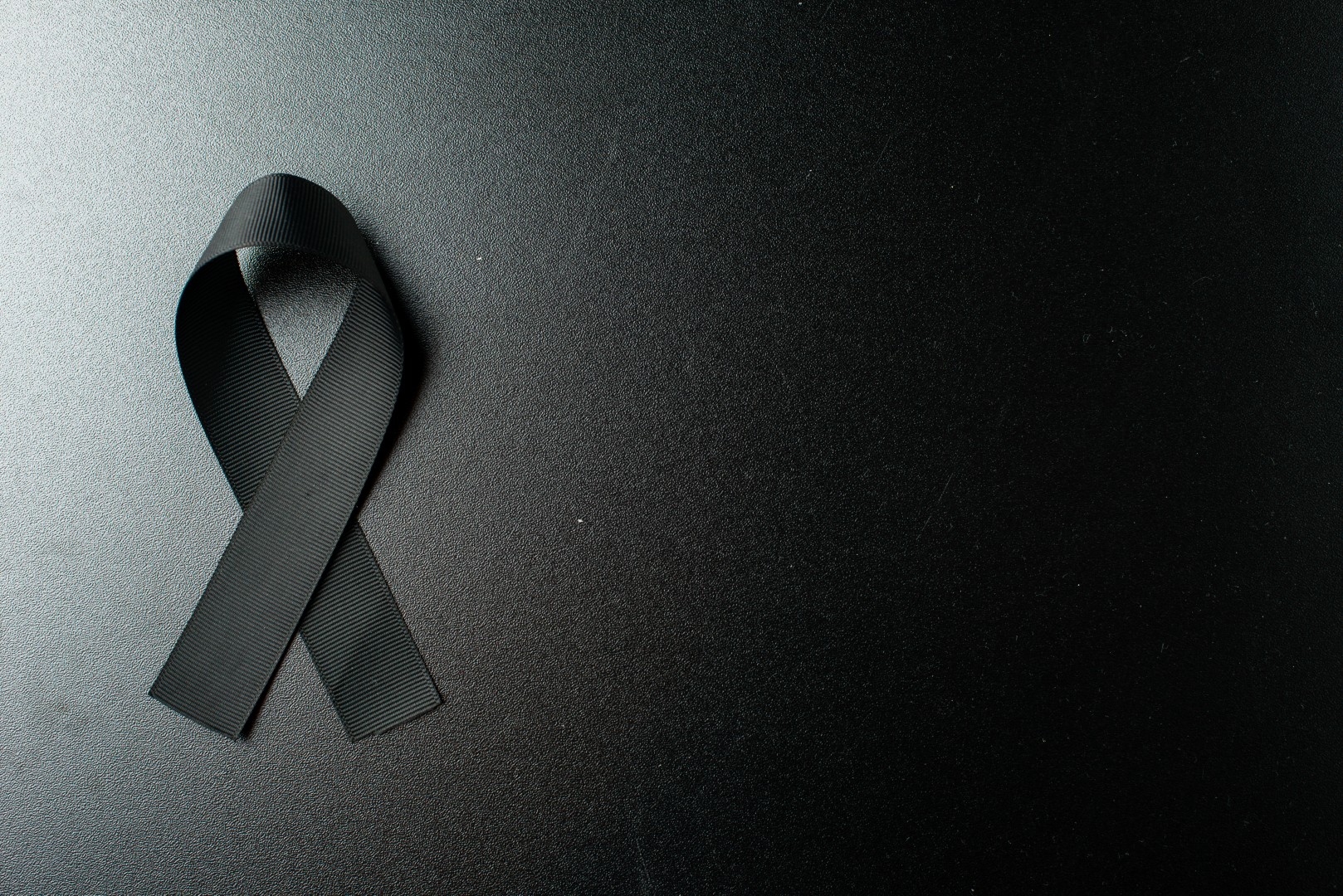 Top View Black Bow As Mourning Symbol Dark Wall